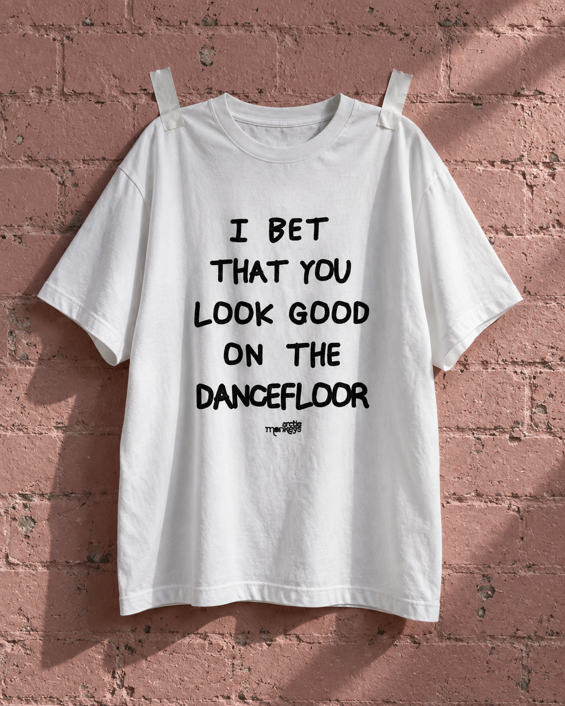 Arctic Monkeys I Bet You Look Good On The Dancefloor White Heavy Weight Tee — Pink wall | NEVER ENOUGH gallery